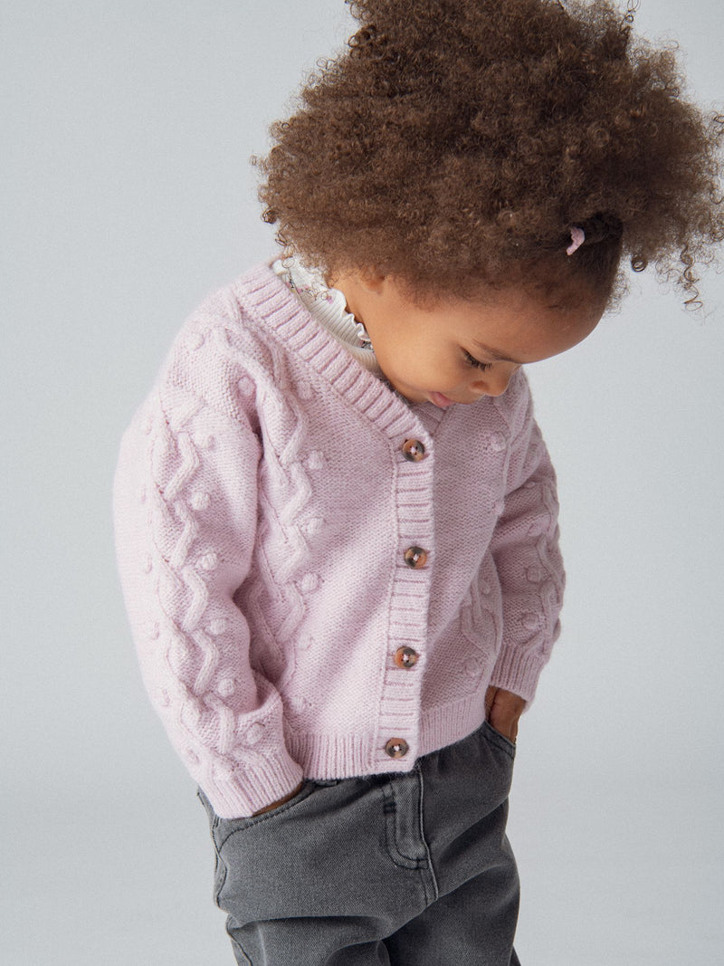 Cardigan en maille torsadée rose poudré pour bébé fille
