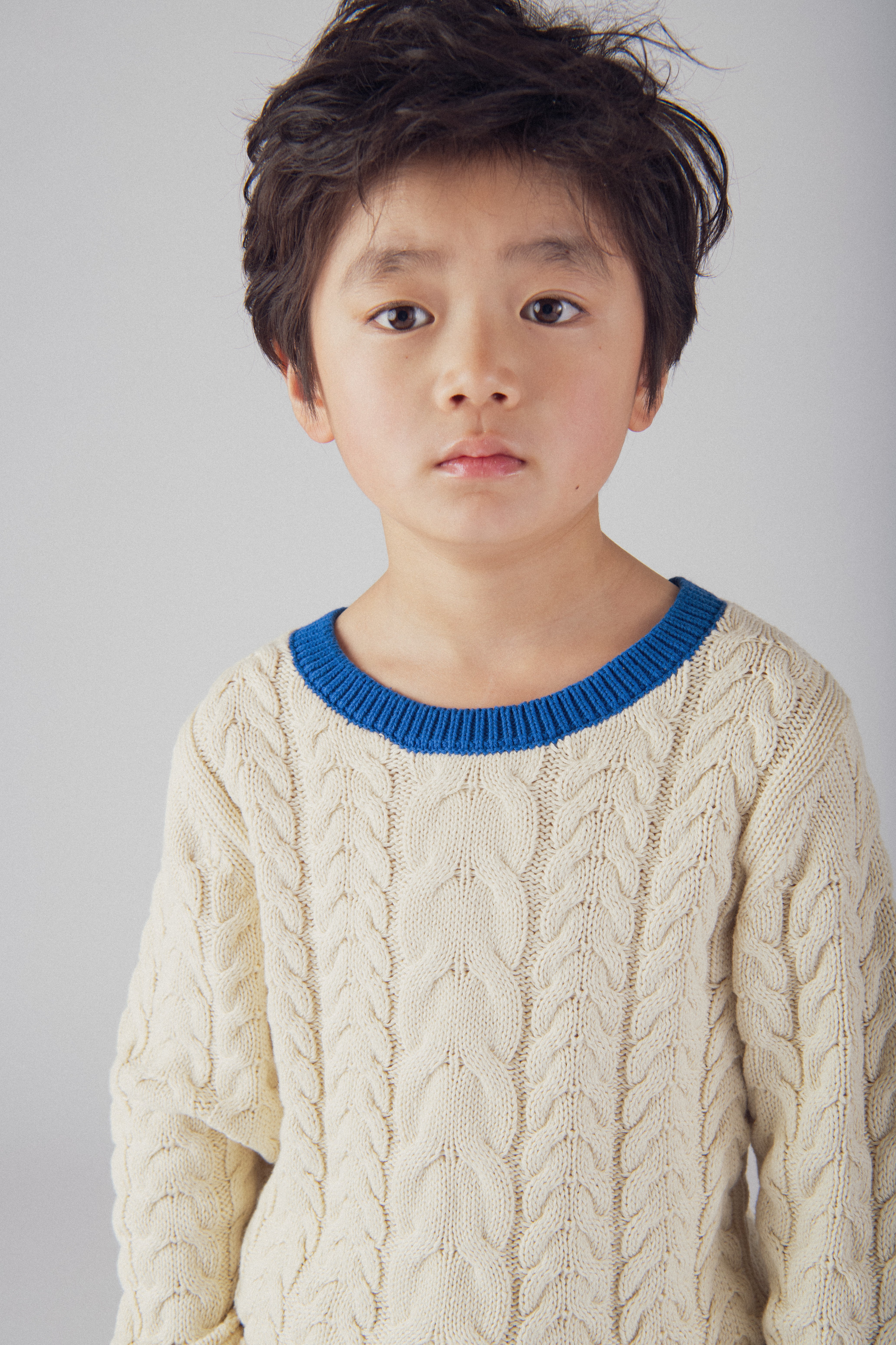 Pull beige a détails bleu pour garçon