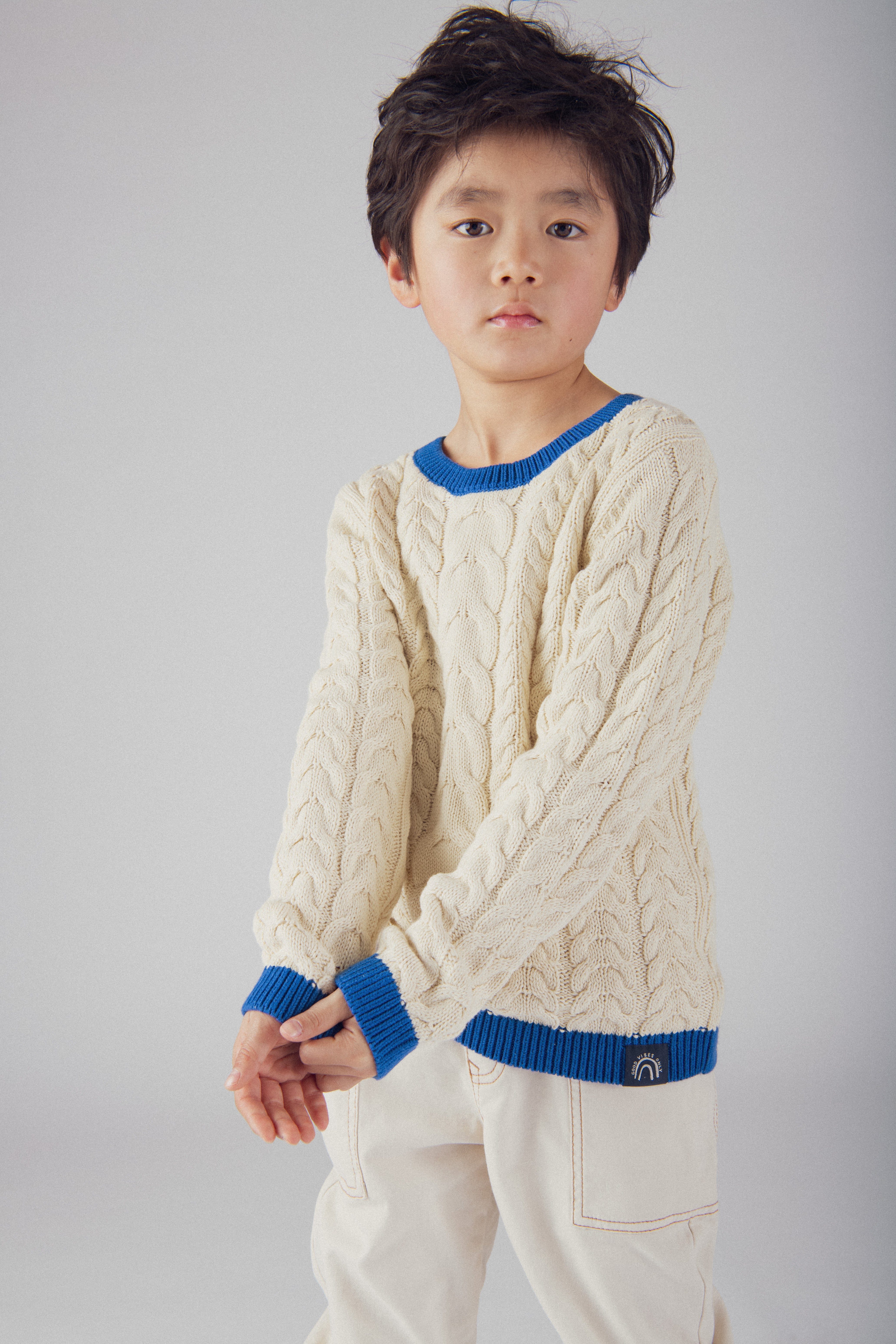 Pull beige a détails bleu pour garçon